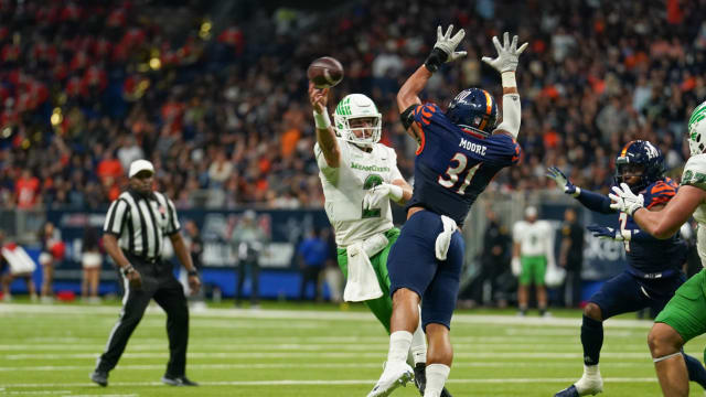 Dec 2, 2022; San Antonio, Texas, USA; North Texas Mean Green quarterback Austin Aune (2) passes in front of UTSA Roadrunners linebacker Trey Moore (31) in the second half at the Alamodome. Mandatory Credit: Daniel Dunn-USA TODAY Sports
